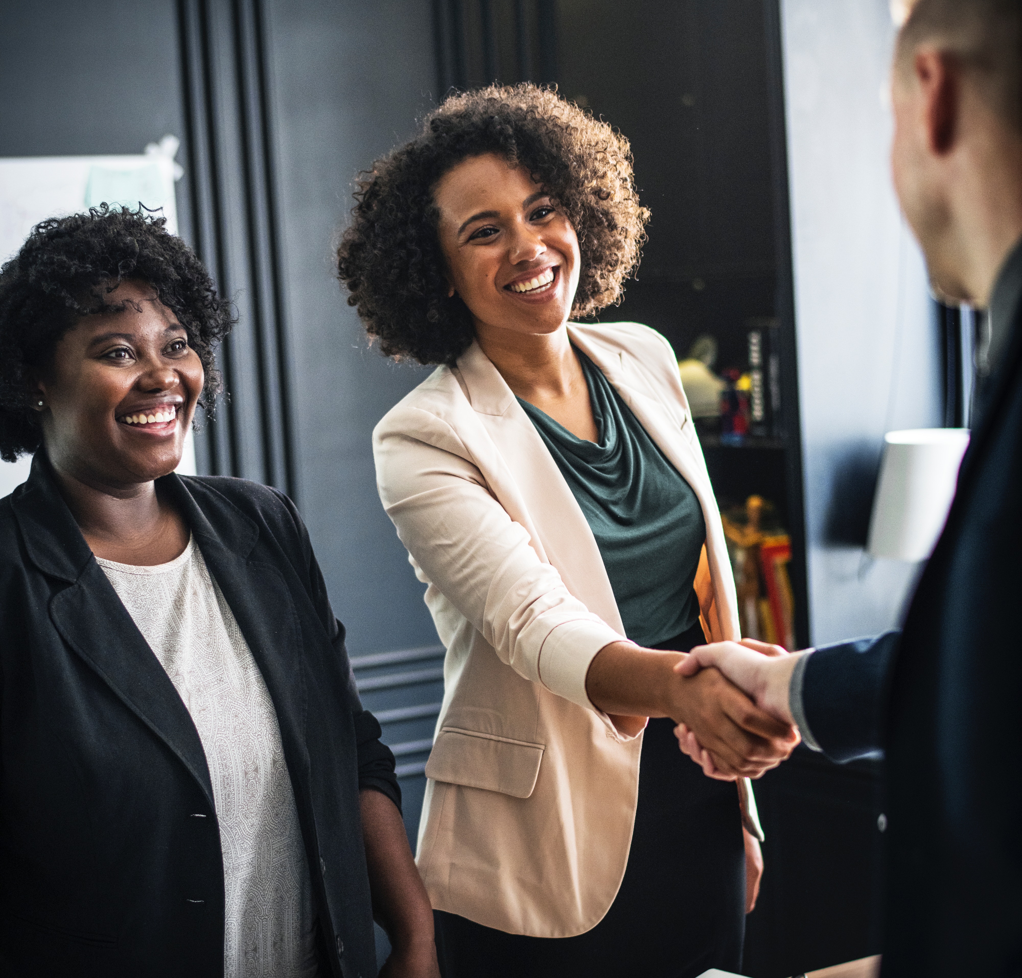 man and women shaking hands